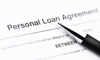 personal loan application form with pen