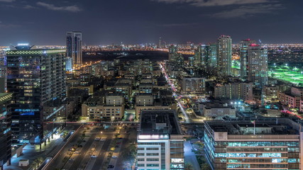Tecom, Barsha and Greens districts aerial view from Internet city night timelapse
