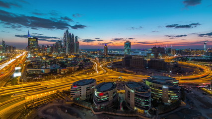 Fototapeta na wymiar Dubai Media City with Modern buildings aerial day to night timelapse, United Arab Emirates