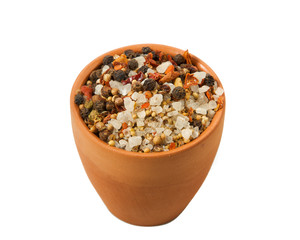 A mixture of seasonings in a bowl isolated on a white background. Spice on isolate. View from above.