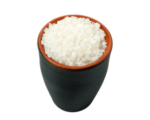 Coarse salt in a bowl isolated on a white background. View from above.