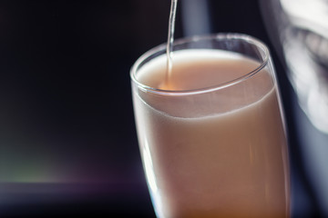 glass of beer full of foam