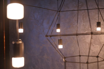 stylish fashion little light bulbs in the trendy loft room indoors with nobody