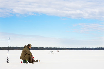 winter fishing Fisherman enjoying a day on the ice