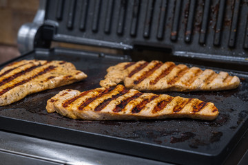 Turkey fillet steaks grilled in the home kitchen. Horizontal orientation