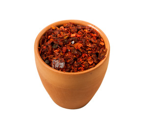 Mix of slices of peppers in a bowl isolated on a white background. View from above.