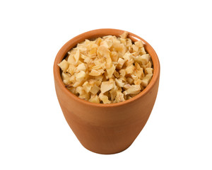 Garlic dry on isolate. View from above. Slices of dried garlic in a clay bowl. Dry seasoning.