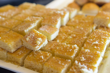 Fresh Muffins cut squares served.