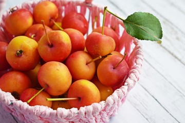 Delicious,ripe Ranetki-small apples on wooden background.