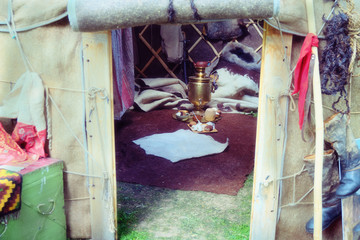 Yurts of nomadic peoples of Siberia in Russia. Portable dwelling Buryat tribes with a samovar and cups inside. The tent housing the nomads.