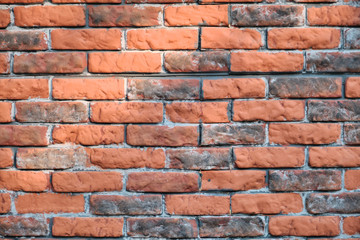 Texture brick wall is orange. Background of shabby and dirty brickwork. Texture retro wasting away red brick walls.