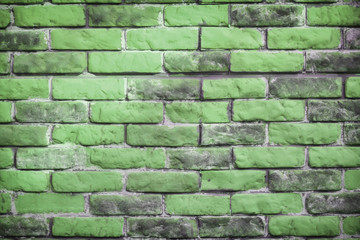 Background of the brick wall is green. Wasting away the background of vintage brick walls. Texture...