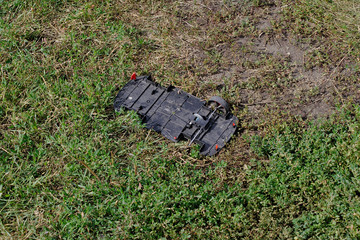 broken toy car in the grass