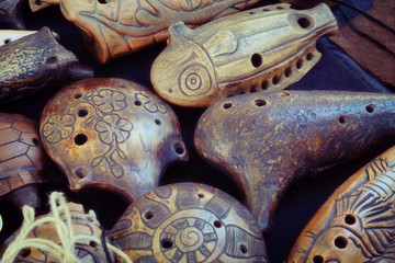 Ocarina, whistle — wind musical instrument, kind of whistle vascular flute. There are earthenware, porcelain and wooden ocarinas - obrazy, fototapety, plakaty