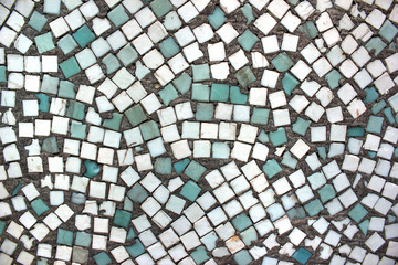 Cyan and white ceramic tiles in an abandoned swimming pool