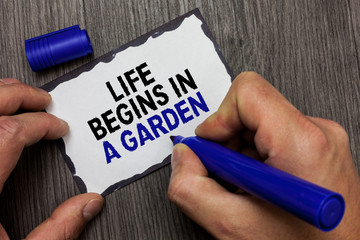 Handwriting text Life Begins In A Garden. Concept meaning Agriculture Plants growing loving for...