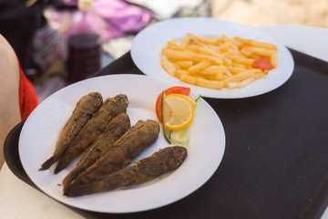 Sea fried goby on a plate.