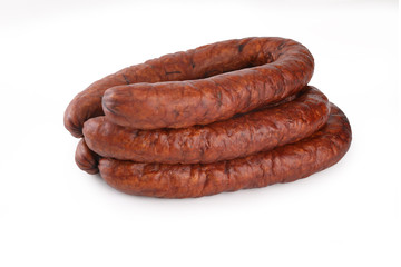 Smoked thin sausage on a white background. Food product.