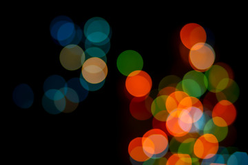Bokeh abstract texture. Colorful. Defocused background.Bright lights on dark background.