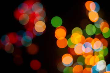 Bokeh abstract texture. Colorful. Defocused background.Bright lights on dark background.