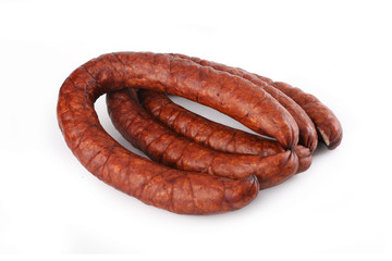 Smoked thin sausage on a white background. Food product.