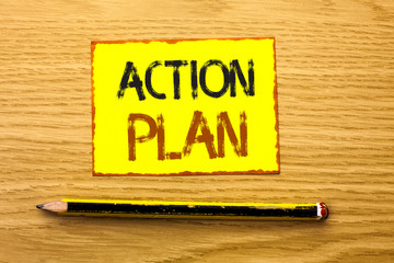 Conceptual hand writing showing Action Plan. Business photo showcasing Strategy Operational Planning Procedure Activity Goal Objective written Yellow Sticky Note wooden background Pencil.