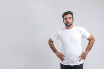 young Indian man giving multiple expression.