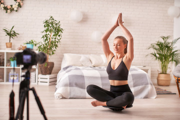woman doing exercise on a special simulator balancer.