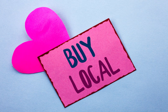 Writing note showing Buy Local. Business photo showcasing Buying Purchase Locally Shop Store Market Buylocal Retailers written Pink Sticky Note Paper the Plain background with Heart.