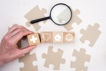 Doctor hand arranging wood block stacking with icon healthcare search, insurance for your health...