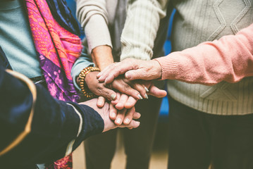 Group of seniors making activities inside the hospice.