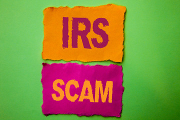 Handwriting text Irs Scam. Concept meaning Warning Scam Fraud Tax Pishing Spam Money Revenue Alert Scheme written Tear Papers the Green background.