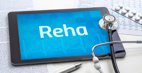 Ein Tablet mit dem Text Reha auf dem Display