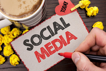 Writing note showing Social Media. Business photo showcasing Communication Chat Online Messaging Share Community Societal written Man Holding Marker Cardboard wooden background Today Coffee.