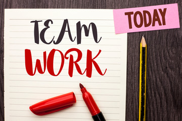 Writing note showing Team Work. Business photo showcasing Cooperation Together Group Work Achievement Unity Collaboration written Notebook Paper the Wooden background Today Marker Pencil.