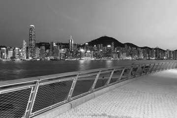 Seaside promenade of Victoria Harbor of Hong Kong city at dusk