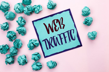 Conceptual hand writing showing Web Traffic. Business photo text Internet Boost Visitors Audience Visits Customers Viewers written Sticky Note Paper the light pink plain background.