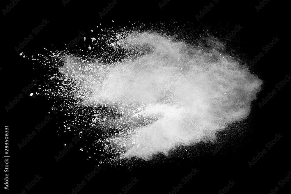 Wall mural freeze motion of white color powder exploding on dark background.