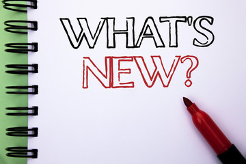 Handwriting text What s New Question. Concept meaning Asking Questionaire Inquiry Problem Questioning written Notebook Book the plain background Marker next to it.