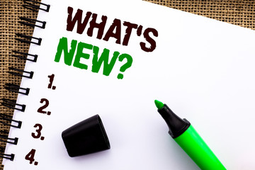 Text sign showing What s New Question. Conceptual photo Asking Questionaire Inquiry Problem Questioning written Notebooke Book the jute background Marker next to it.