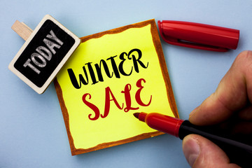 Word writing text Winter Sale. Business concept for Promotion Offer Shop Discount Season Offers Auction Deal Objective written by Man Holding Marker Sticky Note Paper the plain background Today