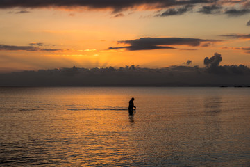 Obraz na płótnie Canvas early morning swim at sunrise