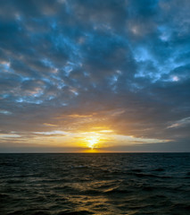 Fototapeta premium Sunset off the coast of the island of Roatan