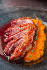 Juicy duck with pumpkin puree. Restaurant food