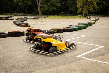 kart small bolide cars on track ready for racing, entertainment action concept photography 