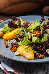 Fresh salad with cheese, nuts and apples