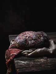 Bread on a rural on a black background. homemade baking