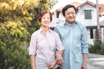 Fototapeta premium Happy elderly couple with lifestyle after retiree concept. Lovely asian seniors couple embracing together .