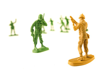 miniature toy soldiers on white background, close-up