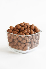 sweet corn chocolate balls in a glass plate on a white background